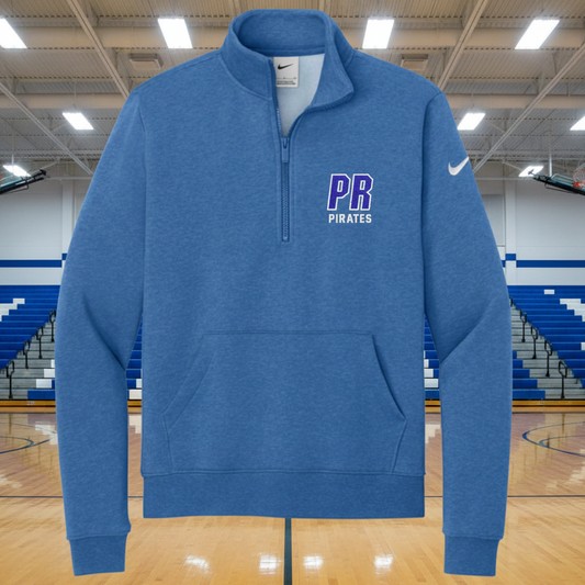 A heather blue Nike quarter-zip pullover sweatshirt with a white swoosh on the left sleeve and 'PB PIRATES' printed in purple and white on the left chest, shown on a plain white background.